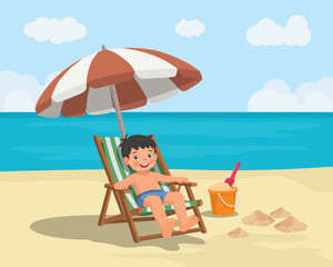 Little boy sitting on beach chair relaxing under umbrella on the beach at summer vacation