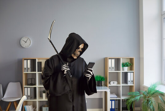 Grim reaper with scythe browsing internet on phone in office, embodying skeleton activity, merging online engagement with a terrifying presence in a business space marked by eerie digital interaction. - Powered by Adobe