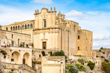 Fototapeta premium Detailed close-up of a grand historic church built from warm limestone blocks in Matera town, Apulia, Italy