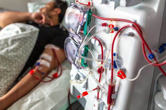 Germany, Bavaria, Munich, Portrait photograph of a man in the dialysis unit of a hospital
