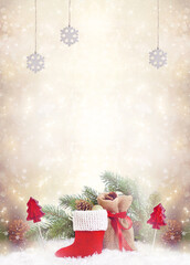 Christmas background with decorative Santa's red boot and gift bag, lollipop candy and fir tree branch. New Year winter holidays fantasy card with decor and copy space, festive postcard.