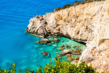 Fototapeta premium Amazing sea bay at Porto Katsiki beach with white rock cliffs and blue azure sea, Lefkada island, Greece