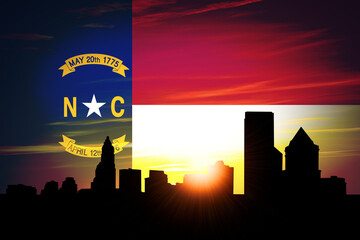 Charlotte Skyline at Sunrise with North Carolina Flag in Sky