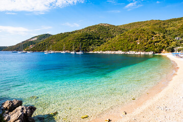 View of beautiful Mikros Gialos beach and calm turquoise sea water, Lefkada island, Greece
