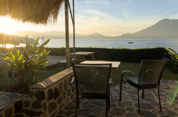 morning sunrise view of volcanos on lake atitlan (volcanic mountains at daybreak) volcano water guatemala glow horizon travel tourism central america