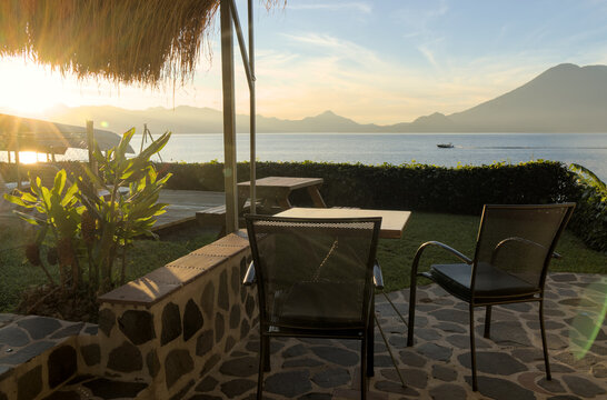morning sunrise view of volcanos on lake atitlan (volcanic mountains at daybreak) volcano water guatemala glow horizon travel tourism central america