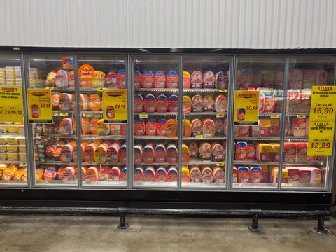 BELO HORIZONTE, MG/BRAZIL &ndash; NOVEMBER, 15, 2025: Refrigerated display case filled with packaged cold cuts and promotional signs in a supermarket.