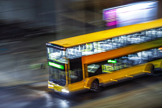 Panning shot of a city bus in Berlin at night