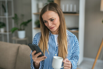 Young woman relaxing at home browsing social media