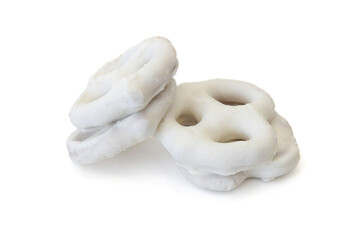 White chocolate covered pretzels on white background