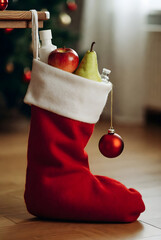 Festive Christmas Stocking Filled With Fruits and Gifts