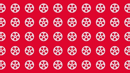 Red background filled with white film reels perfect for movie related designs, film festivals, cinema promotions, and creative projects.