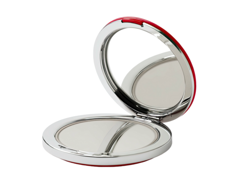Opened silver makeup compact with mirror on black background