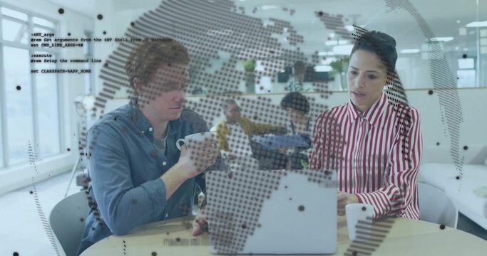 Pointing woman in striped top, man with mug reviewing code at round table with laptop map-overlay