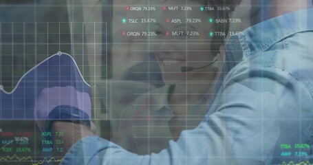 Pointing man in blue shirt extending arm toward glass display at office, with headset and charts