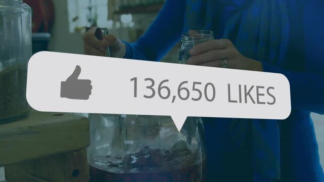 Man stirring jar and scooping with ladle showing product while social media likes rising to 902,208
