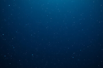 Obraz premium Deep Blue Cosmic Sparkle Backdrop with Floating Particles and Subtle Light Rays for a Mystical Ambiance