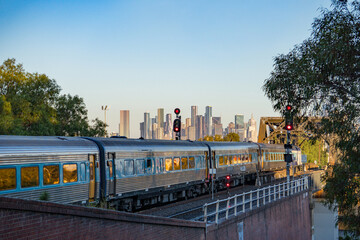 Melbourne city skyline with Metro train passing by, Skyline CBD Melbourne, View of Melbourne from Footscray. © niltondaly