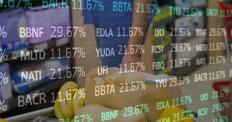 Midadult woman shopping at grocery tray on overlay appearing while cycling % over bananas squash