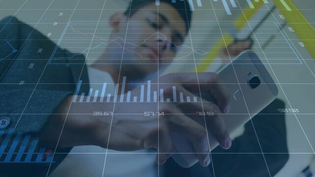 Commuter standing on train, thumb-typing and animating finance charts on phone, checking stocks