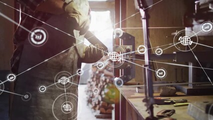 Craftsman adjusting clamp as network nodes fading in overlaying bench and showing woodworking data - Powered by Adobe