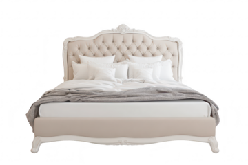 Elegant upholstered bed with a tufted headboard and plush pillows. set against a clean white background. ideal for interior design inspiration or furniture advertising