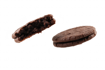 A close-up view of two chocolate sandwich cookies. one broken in half. suspended in mid-air against a clean white background. the creamy filling inside. perfect for food photography