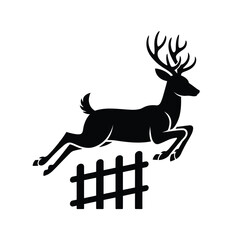 Silhouette of a majestic stag leaping over a fence