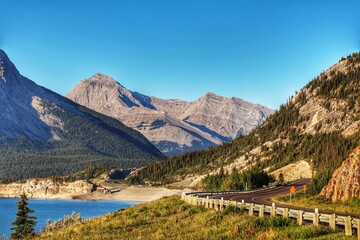 Winding Mountain Road Along Turquoise Lake in the Rockies