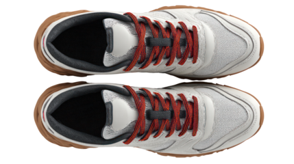Pair of white athletic shoes with red laces isolated on transparent background