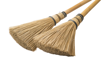 Two rustic brooms with wooden handles isolated on transparent background