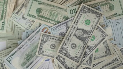 money spread presentation, cash layout with various banknotes, arrangement of different denominations of currency notes, display of assorted currency bills on textured green background