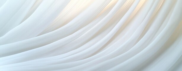 soft sheer white fabric draped in flowing delicate folds with warm light creating a calm serene airy atmosphere