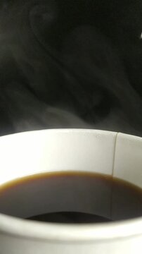 cup of coffee on black background