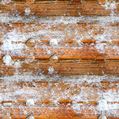 Seamless 4k photo texture of ornate veneer wood material surface covered in snow.