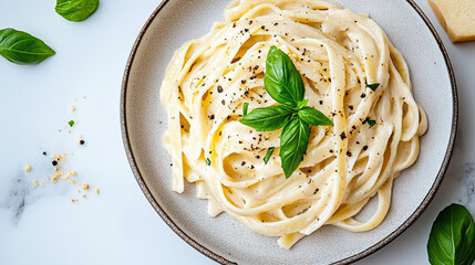 Creamy cashew Alfredo pasta basil black pepper garnish