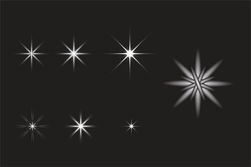 Obraz premium Glowing Star Light Effects on Dark Background