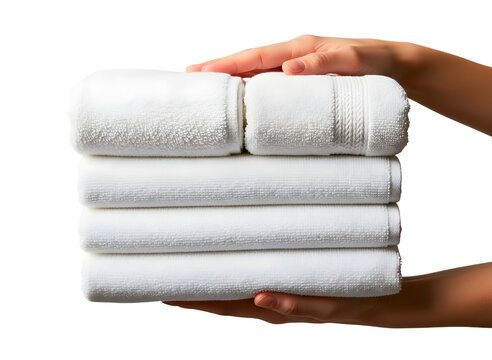 Hands holding a stack of clean white bath towels isolated on transparent background