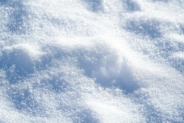 Close-up of sparkling fresh snow with soft undulating mounds and glistening crystal texture, bathed in cool blue light, evoking serene winter calm
