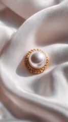 Elegant Pearl Button on Silky White Fabric, Soft Lighting, Luxurious Texture.
