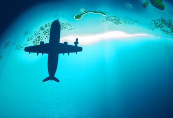 airplane silhouette flying over tropical islands map