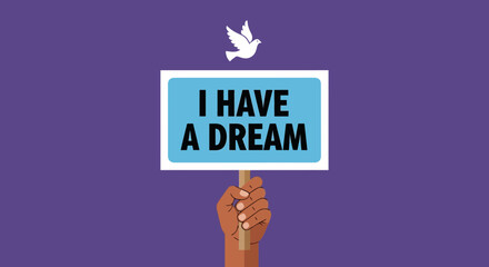 Hand holds I Have A Dream sign with dove above in peaceful demonstration