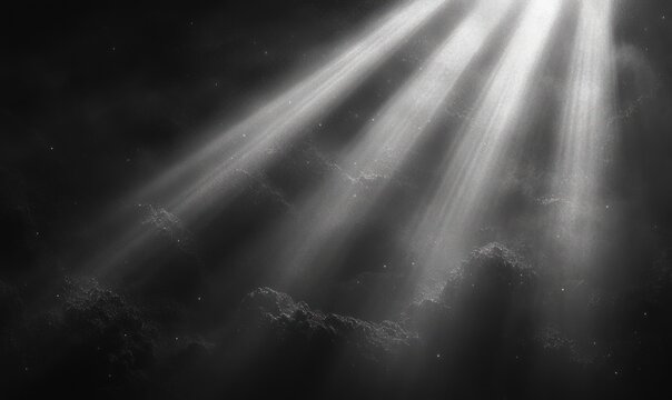 Ethereal beams of light piercing dark mist and drifting dust over shadowy cloud-like forms, creating a serene and mysterious monochrome atmosphere