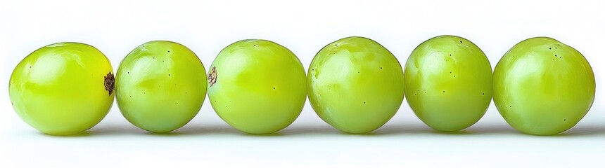 six glossy green grapes arranged in a neat row on a bright white background, fresh and inviting