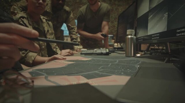Military Team Strategizing Over a Satellite Map During Night Surveillance