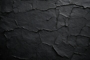 Fototapeta premium dark cracked plaster wall with rough peeling texture, irregular fissures and moody dramatic tones