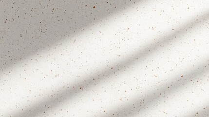 Cream speckled terrazzo surface with tiny brown flecks and soft diagonal shadow bands, minimalist calm and serene background