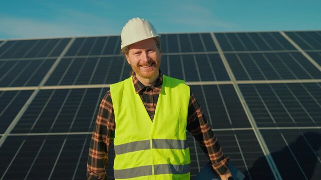 Expert evaluates solar panel installation at renewable energy site in sunny California