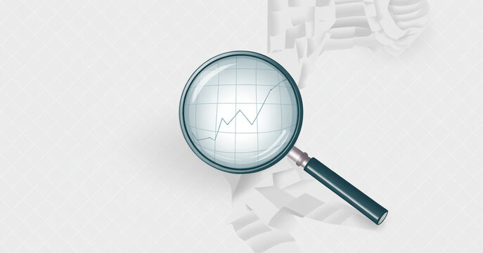 Magnifying glass examining a blueprint or architectural drawing