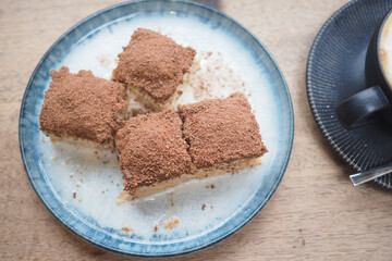 Delicious ice baklava served on a blue plate with coffee